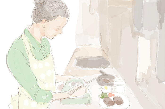 お弁当を作っている女の人